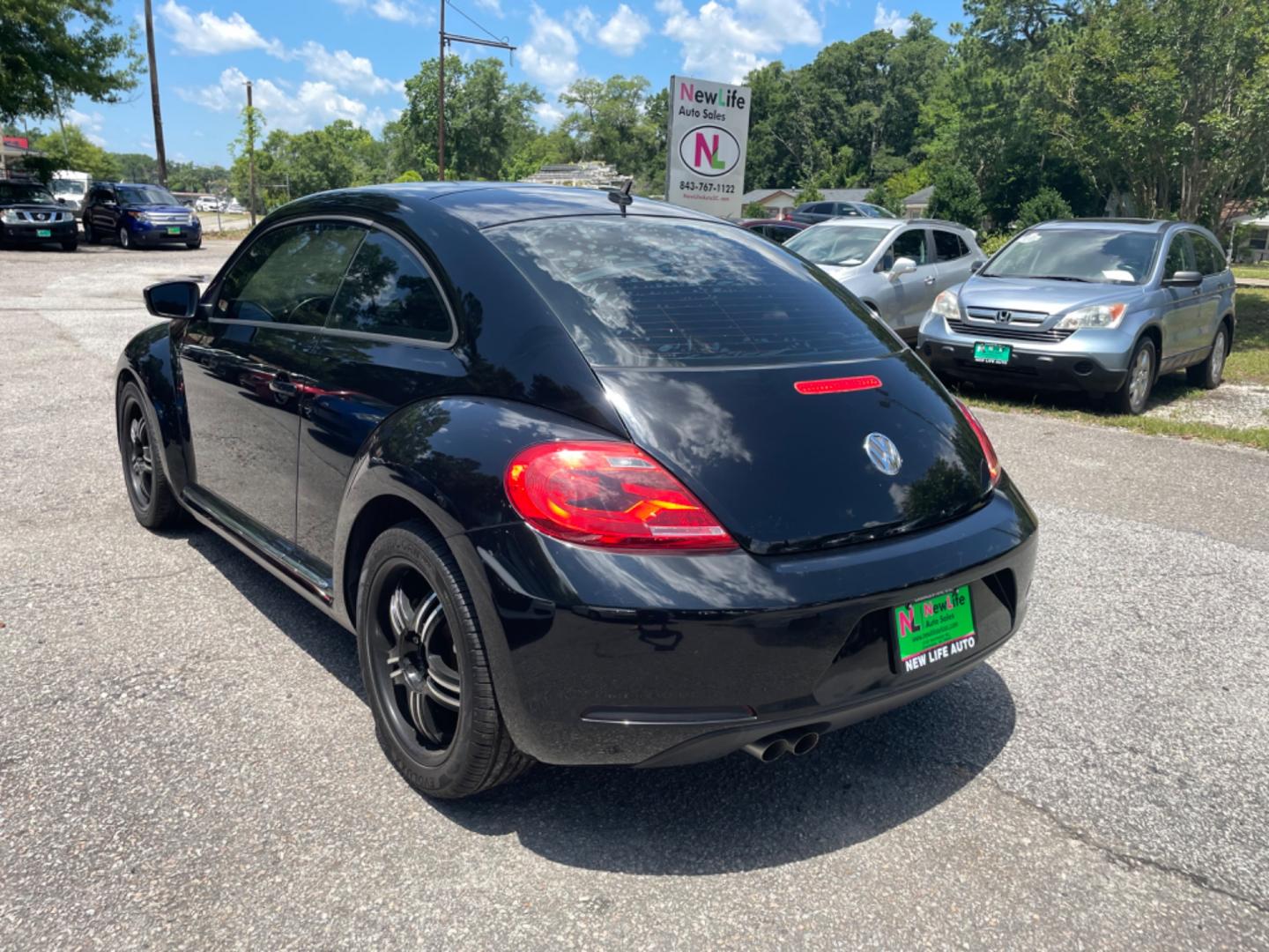 2012 BLACK VOLKSWAGEN BEETLE 2.5L PZEV (3VWJP7AT0CM) with an 2.5L engine, Automatic transmission, located at 5103 Dorchester Rd., Charleston, SC, 29418-5607, (843) 767-1122, 36.245171, -115.228050 - Local Trade-in with Leather, CD/AUX/Bluetooth, Hands-free Phone, Power Windows, Power Locks, Power Mirrors, All-weather Mats, Keyless Entry, Alloy Wheels. Clean CarFax (no accidents reported!) Only 68k miles! Located at New Life Auto Sales! 2023 WINNER for Post & Courier's Charleston's Choice Pre - Photo#5